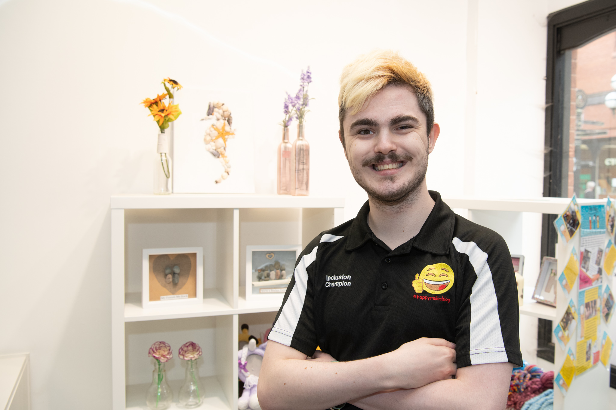 Picture of a young man with his arms crossed