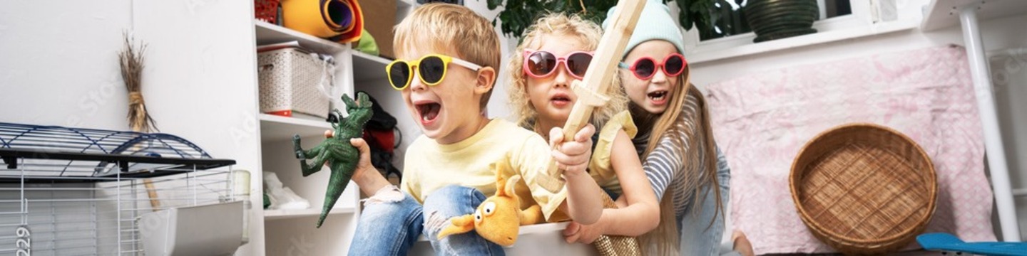 Children have fun and ride in white plastic box