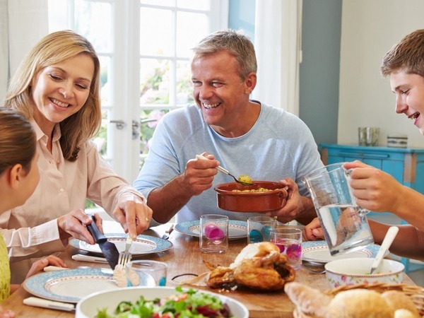 Family sat around a table together